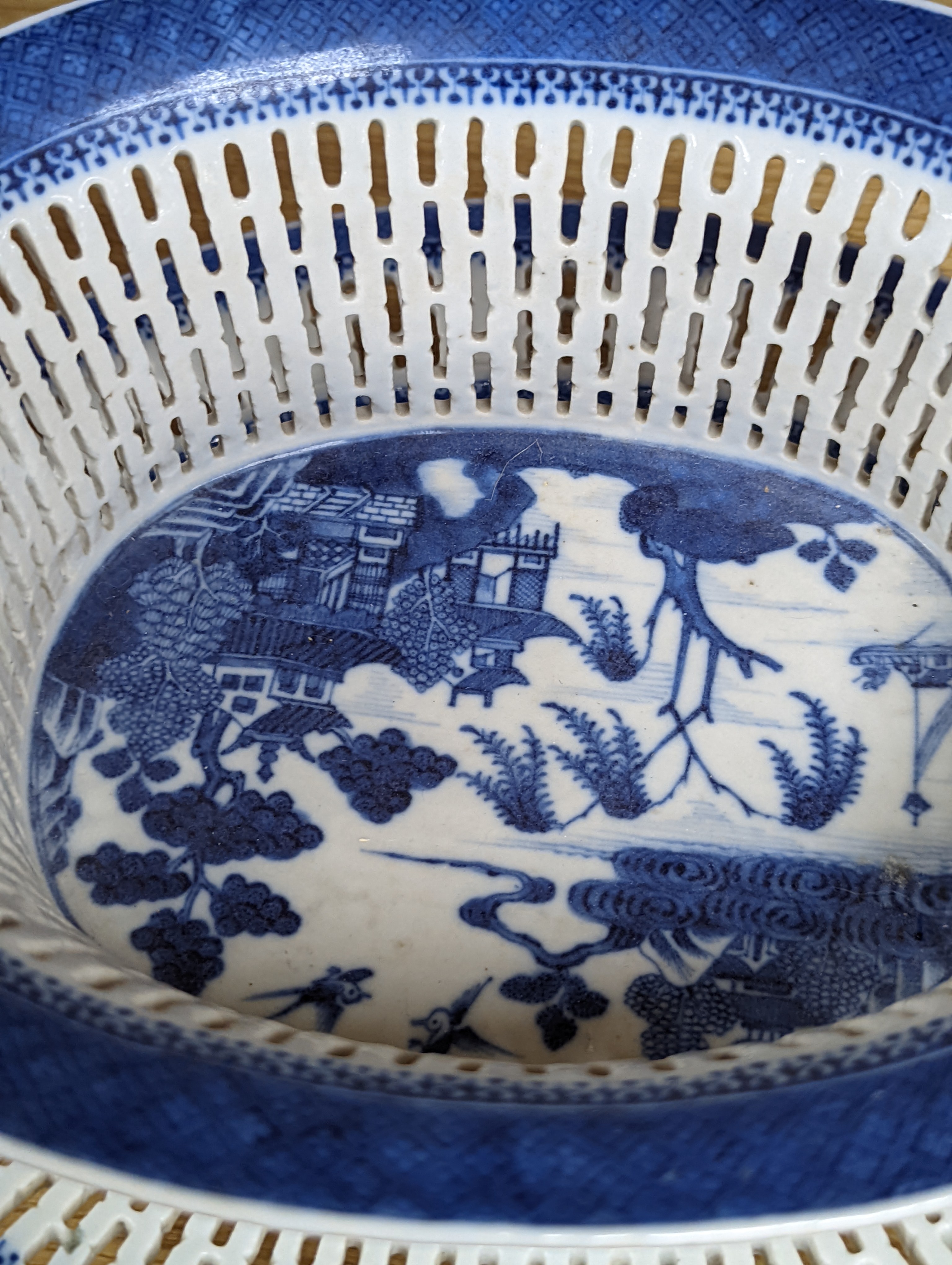 A Chinese blue and white chestnut basket and stand, Qianlong period, basket 11 cms high.